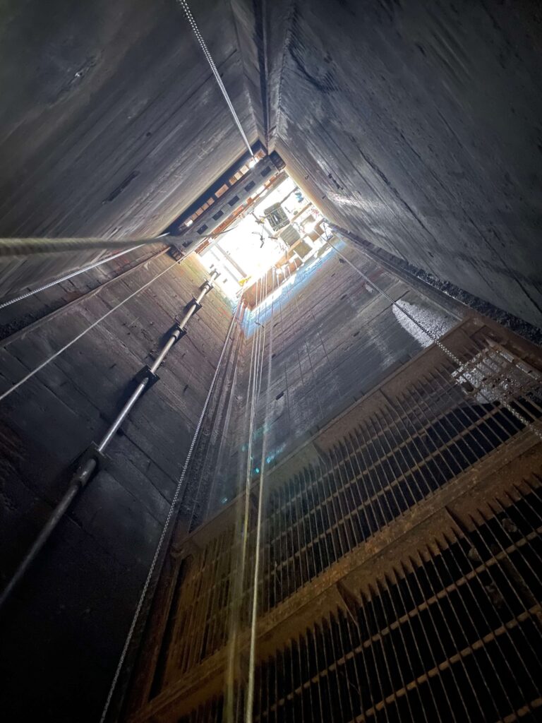 Illuminated interior of building, with sunlight streaming in, casting a soft glow